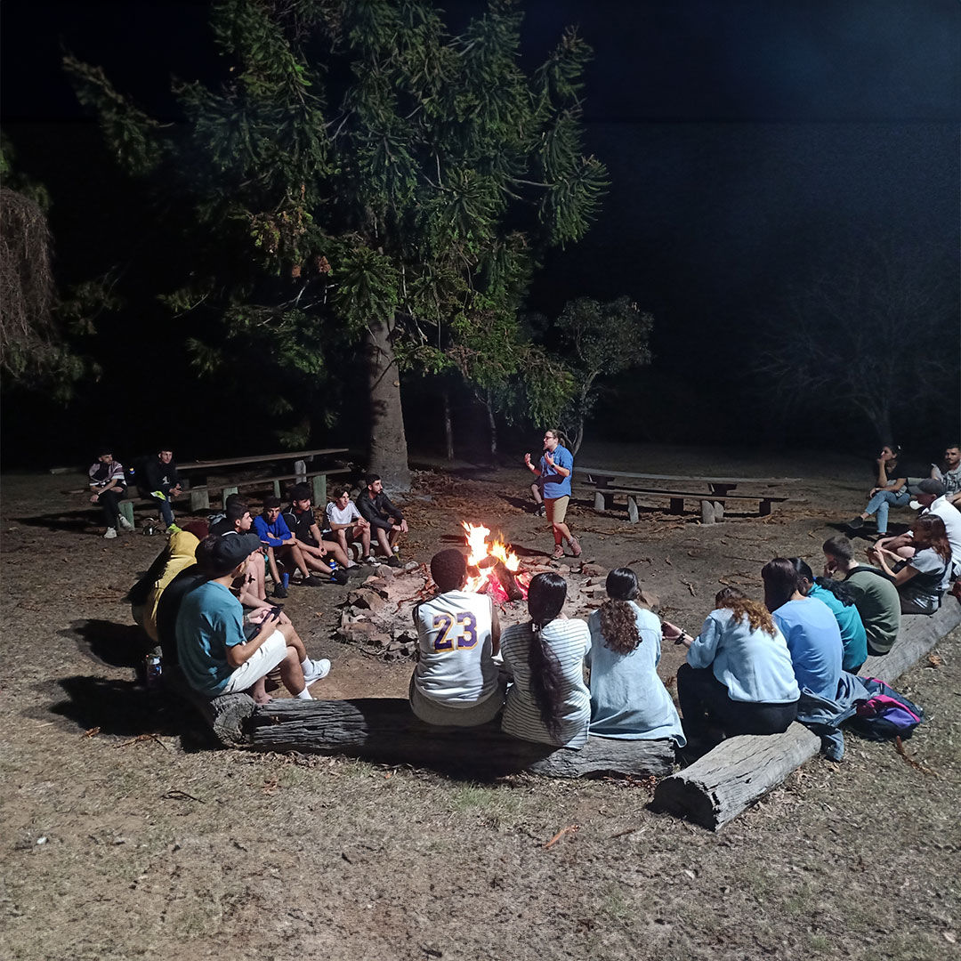 AMEP youth around campfire